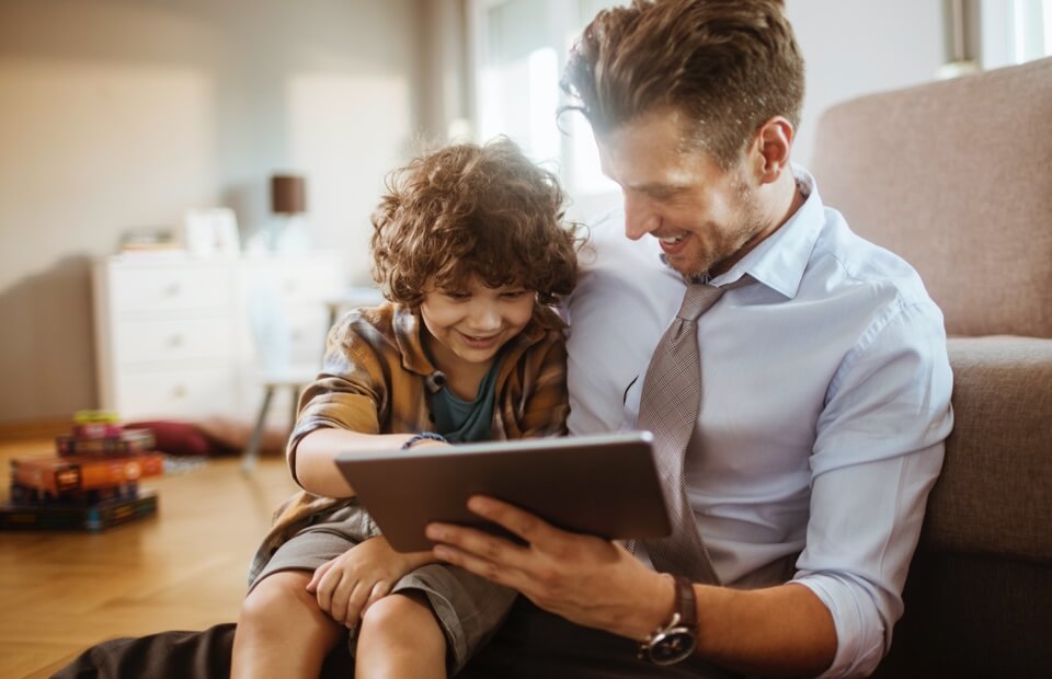 promo image for father showing son his tablet
